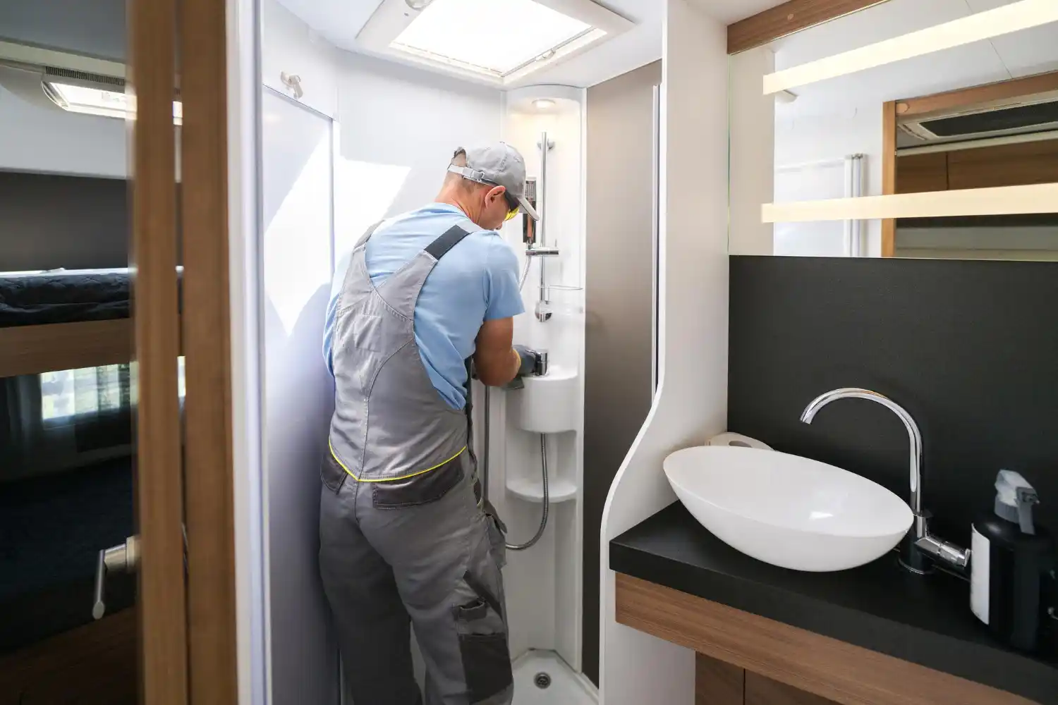 Professional plumber carrying out a new shower installation in a residential bathroom