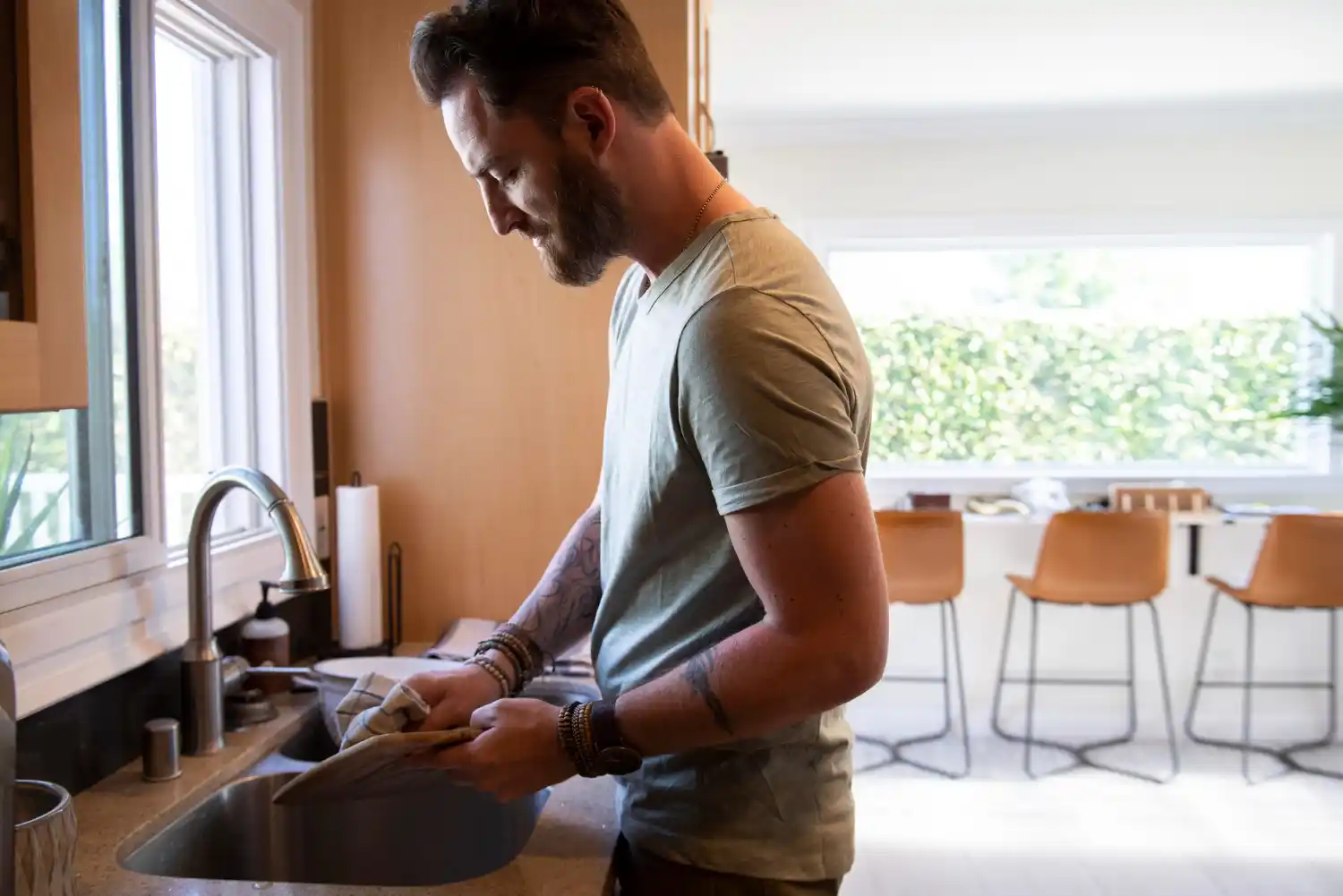 Expert plumber repairing a blocked kitchen sink