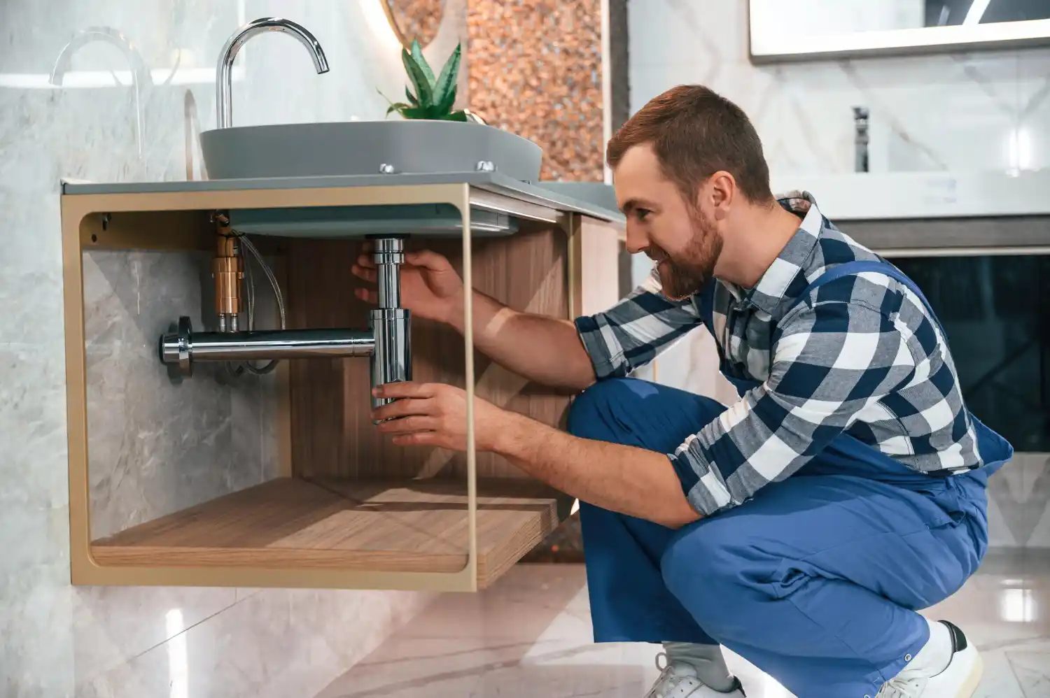 Professional plumber using advanced leak detection equipment to locate and repair hidden leaks