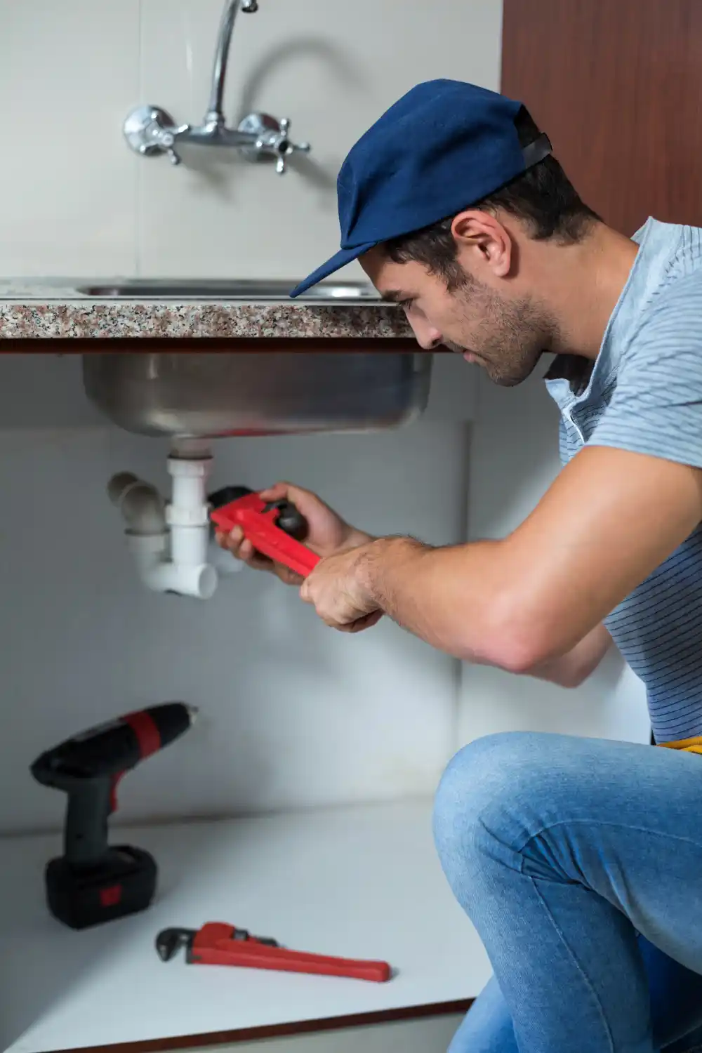Expert plumber performing water leak detection